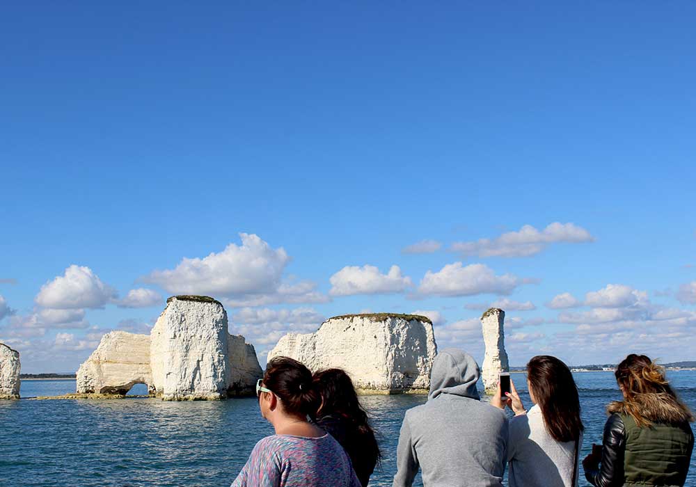 Passengers looking at Old Harry Rocks - City Cruises Poole