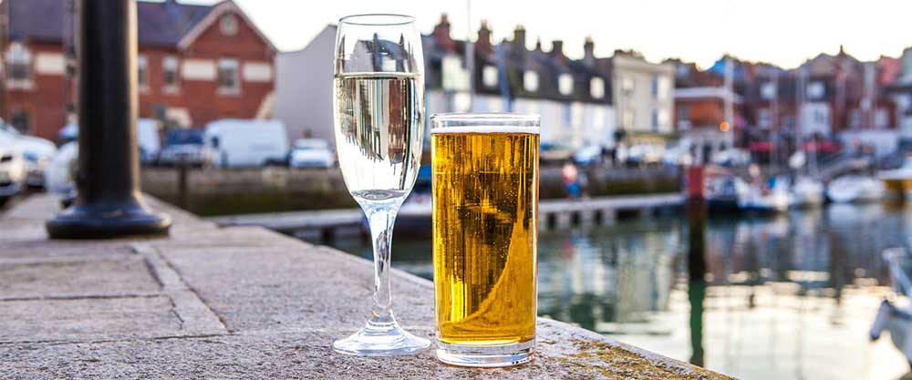 Enjoying a drink beside the harbour in Dorset